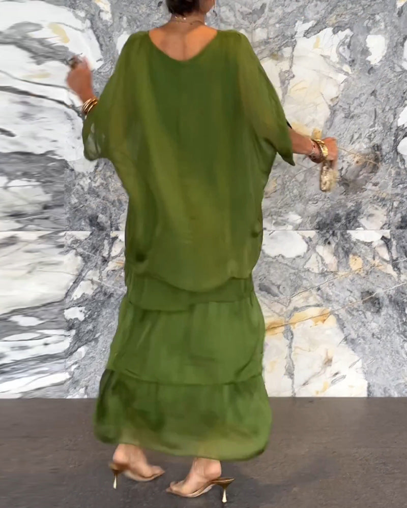 Robe longue artistique : coupe ample, design de manches chauve-souris et élégance fluide