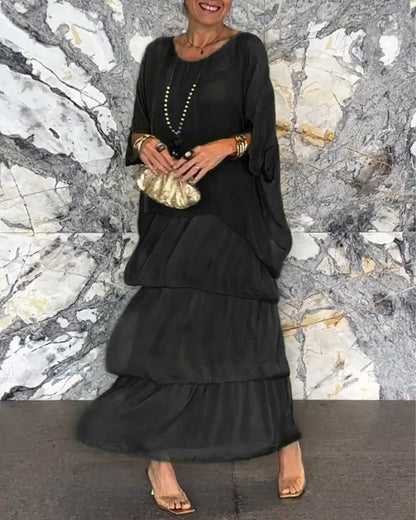 Robe longue artistique : coupe ample, design de manches chauve-souris et élégance fluide