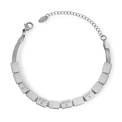 Pulsera Loïs “Love” de titanio chapada en oro de 18 quilates